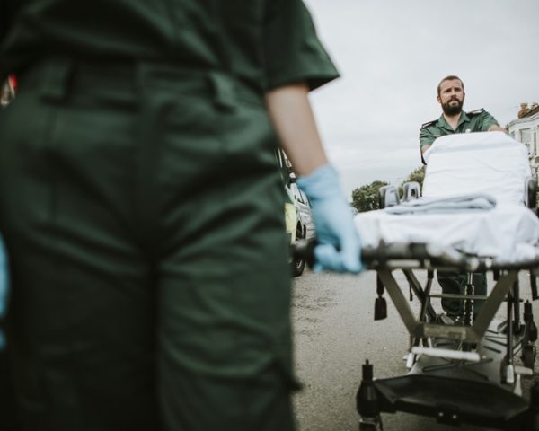 paramedic team rolling a stretcher on a street