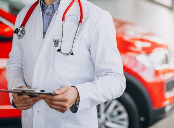 car doctor with stethoscope in a car showroom